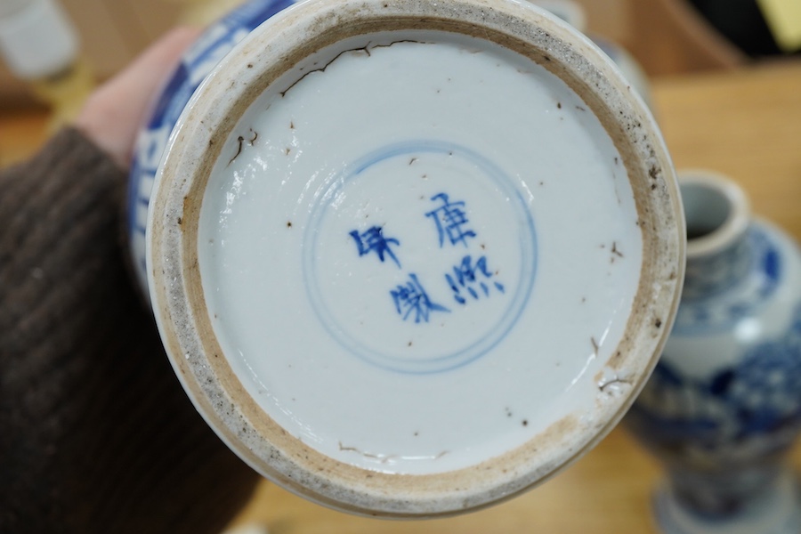 A pair of Chinese blue and white vases and a baluster jar and cover, largest 23cm high
